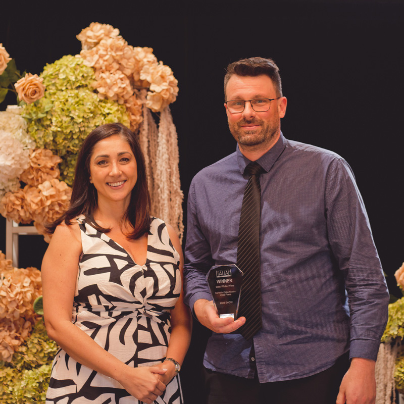 Adrian Santolin holding trophy for his 2022 Fiano at the 2025 australian Italian Varieties Wine Show